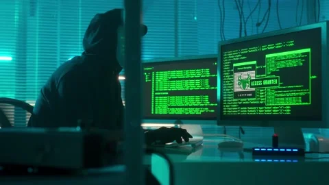 Hacker in a white mask is typing on a computer keyboard and cracking a password Stock Footage 233602668