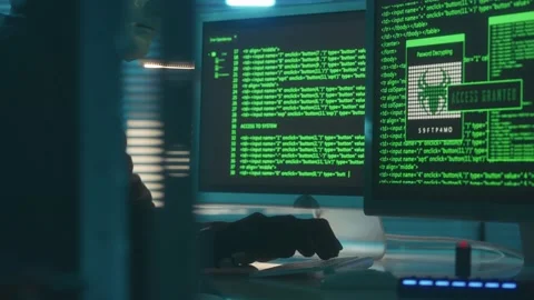 Hacker in a white mask is typing on a computer keyboard and cracking a password Stock Footage 233603396