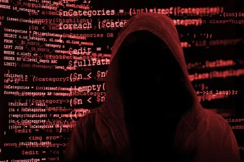 Hacker without face surrounded by source code Foto stock