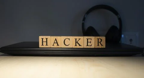Hacker word on block concept. Close up. Stock Photos