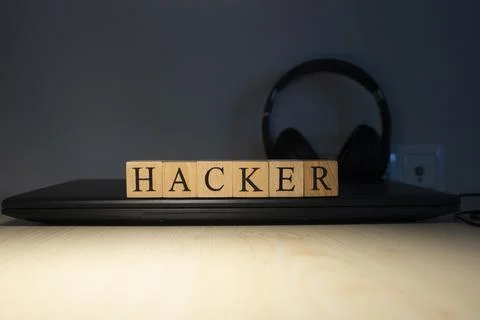 Hacker word on block concept. Close up. Stock Photos