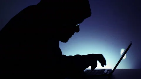 Hacker at work with notebook computer Stockbeeldmateriaal 46941570