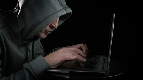 Hacker working against black background. Stock Footage 305765241