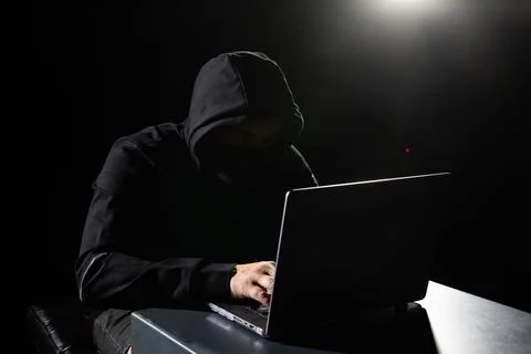 Hacker working on computer cyber crime Stock Photos