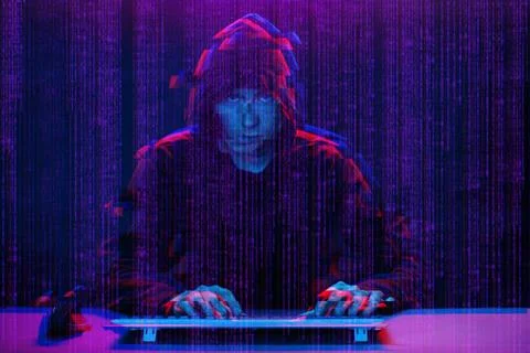 Hacker working with computer in dark room with digital interface around. Image Stock Photos
