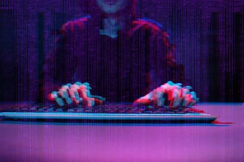 Hacker working with computer in dark room with digital interface around. Image Foto stock