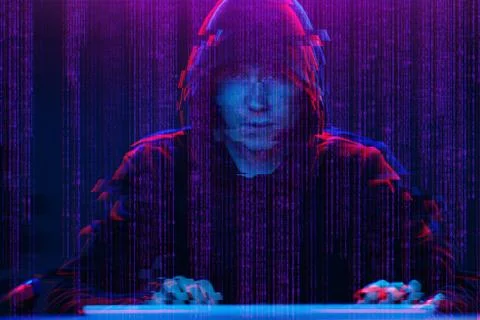 Hacker working with computer in dark room with digital interface around. Image Stock Photos