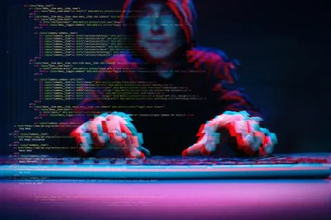 Hacker working with computer in dark room with digital interface around. Image Foto stock