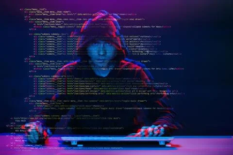 Hacker working with computer in dark room with digital interface around. Image Foto stock