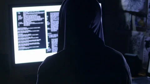 Hacker working on the computer planning a cyber-attack 스톡 동영상 72476873