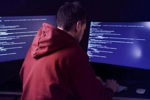 Hacker working with computers in dark room. Cyber attack 写真素材