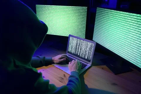 Hacker working with computers at wooden table indoors. Cyber attack 写真素材