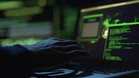 Hacker working on creating malicious software, actively typing on laptop keypad 스톡 동영상 84109351