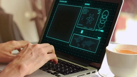 Hacker working hard using a laptop with binary codes in cafe Stock Footage 73289083