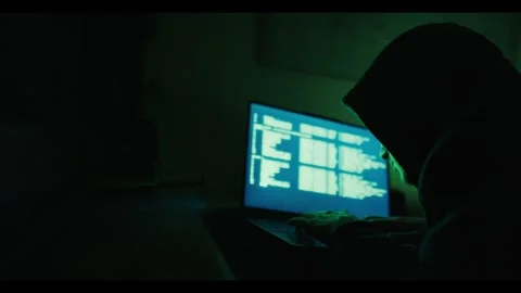 Hacker Working on Laptop in Dark Room Stock Footage 344770525