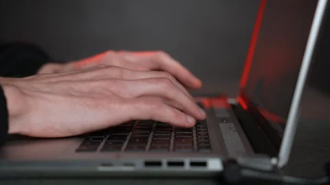 Hacker working on a laptop. Dolly shot. Close-up Vídeo Stock 244542919