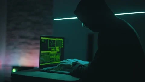 Hacker is working on laptop at night. Hands are typing a virus code at keyboard Stock Footage 150430948