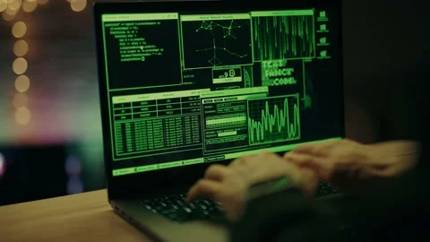 Hacker is working on laptop at night. Hands are typing a virus code at keyboard Stock Footage 152632012
