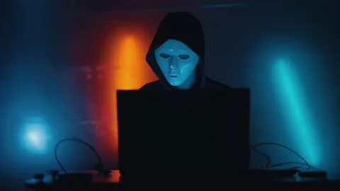 Hacker is working on laptop at night. Hands are typing a virus code at keyboard Stock Footage 164054205