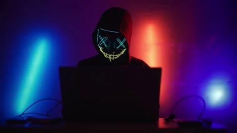 Hacker is working on laptop at night. Hands are typing a virus code at keyboard Stock Footage 164055431