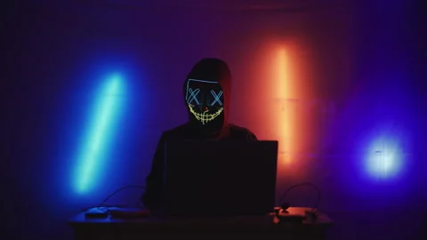 Hacker is working on laptop at night. Hands are typing a virus code at keyboard Stock Footage 164057324
