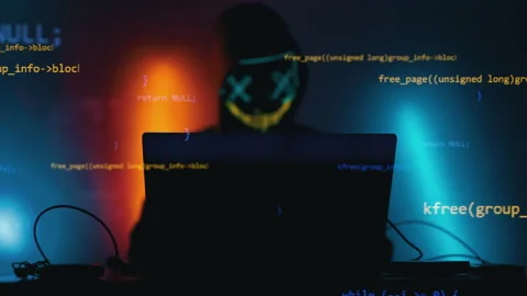 Hacker is working on laptop at night. Hands are typing a virus code at keyboard Stock Footage 164558721