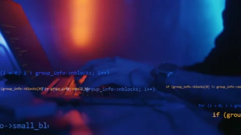 Hacker is working on laptop at night. Hands are typing a virus code at keyboard Video stock 164559952