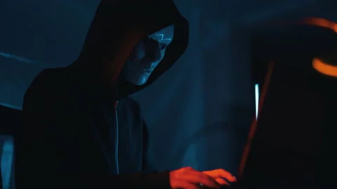 Hacker is working on laptop at night. Hands are typing a virus code at keyboard Stock Footage 166895707