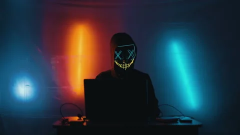 Hacker is working on laptop at night. Hands are typing a virus code at keyboard Stock Footage 166896147
