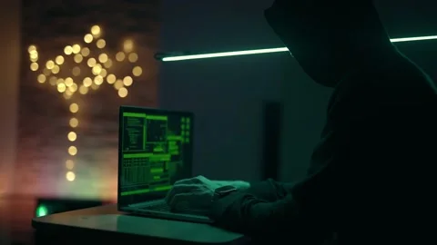 Hacker is working on laptop at night. Hands are typing a virus code at keyboard Stock Footage 218892821