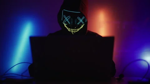 Hacker is working on laptop at night. Hands are typing a virus code at keyboard Stock Footage 220764199