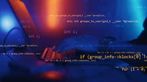 Hacker is working on laptop at night. Hands are typing a virus code at keyboard Stock Footage 220817613