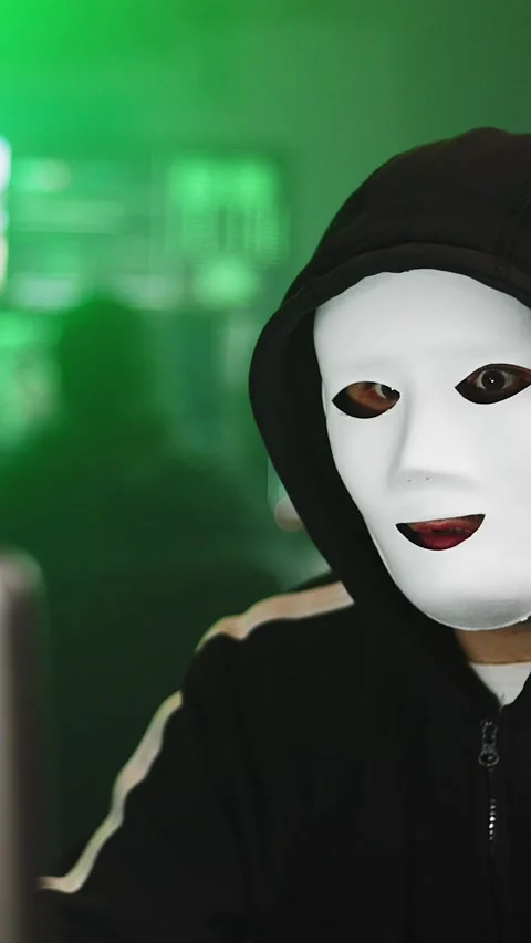 Hacker working on laptop preparing a cyber attack in dark room Stock Footage 316849813