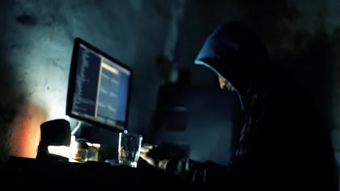 A hacker working in the late hours of the night Stock Footage 242439355