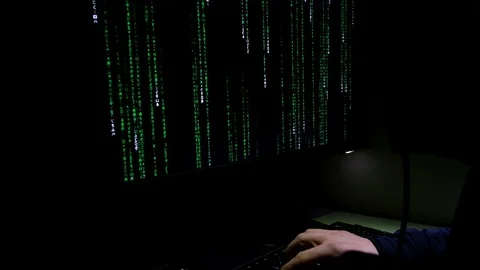Hacker working on pc privacy data decript, cyber web securit,matrix code running Stock Footage 121149832