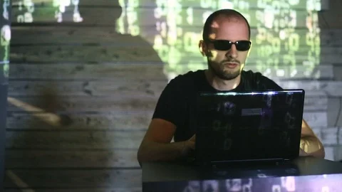 The hacker works behind the computer Stock Footage 99371808