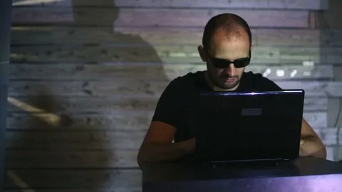 The hacker works behind the computer Stock Footage 99372063