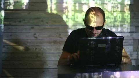 The hacker works behind the computer Stock Footage 99372922