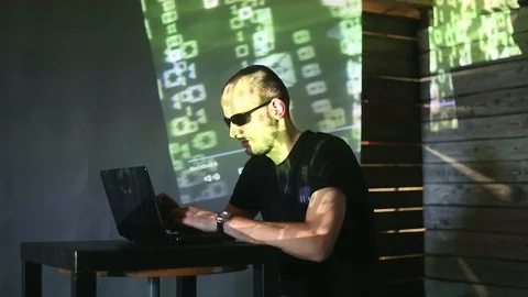 The hacker works behind the computer Stock Footage 99373218