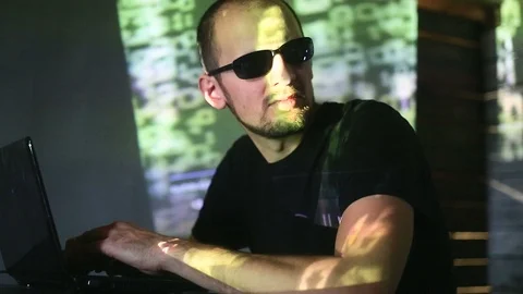 The hacker works behind the computer Stock Footage 99373923