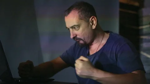 The hacker works behind the computer Stock Footage 99374340