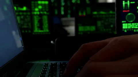 Hacker writes codes and Breaks Into Data Servers, close shot of hands Video stock 140453054