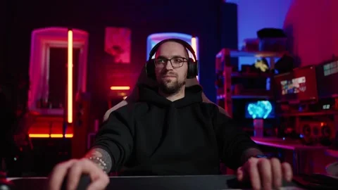 Hacker writing code cracking computer. Man programmer in hoodie cracks system Stock Footage 272792350