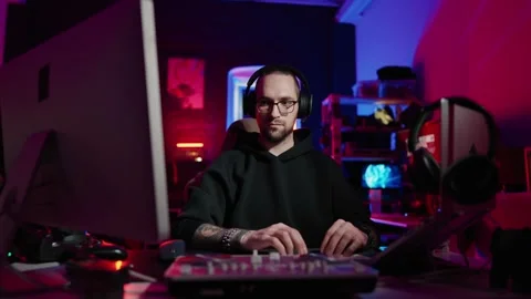 Hacker writing code cracking computer. Man programmer in hoodie cracks system Stock Footage 272909372