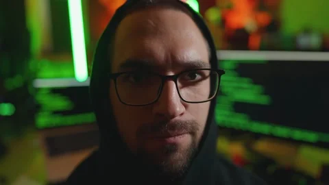 Hacker writing code cracking computer. Portrait close up man programmer in Stock Footage 273512241