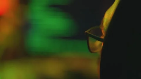 Hacker writing code cracking computer. Man programmer in hoodie cracks system Stock Footage 273512351