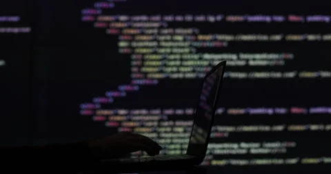Hacker writing code cracking computer. Programming code in the background Stock Footage 278528898