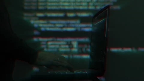 Hacker writing code cracking computer. Programming code in the background Stock Footage 279230042