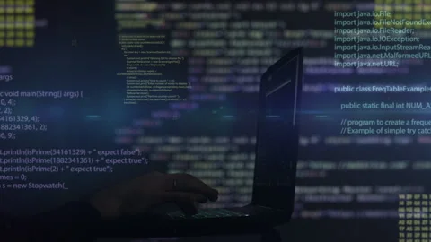 Hacker writing code cracking computer. Programming code in the background. Stock Footage 281005427