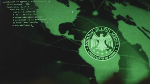 Hacker writing code on laptop with USA National Security Agency sign on Stock Footage 272593131